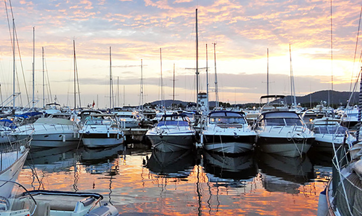 Puerto Portals view of the boats in the marina during the sunset